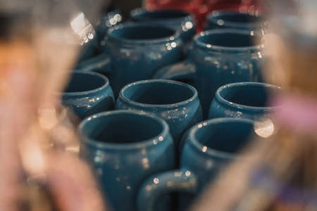 Claz coffee or beer mugs in blue color. A stack of vintage beer mugs stacked one next to each other.の写真素材