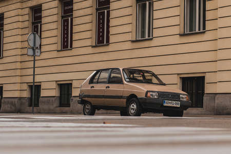 LJUBLJANA, SLOVENIA. 5.11.2019: Old brown Citroen Visa vintage car is parked in a city in front of the facade in same color.のeditorial素材