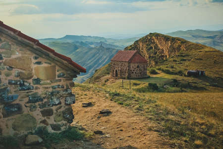 Massive Garedjian Ridge in Georgia near David Gareji Monastery. Houses or churches in the foreground.の写真素材