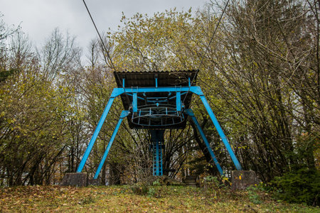 Abandoned ski lifts on the skiing slope of Ulovka, close to Vrhnika, Slovenia in autumn setting but still without snow. Sad decaying ski lifts.の写真素材