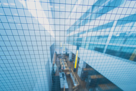 Overhead view of a library or reading room in soft focus, looking through safety glass with wires in...