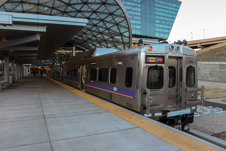 Light rail train departuring from Denver airport towards Union station.