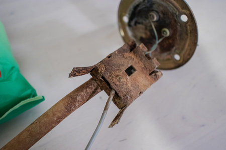 Rusted fuel sending gauge float of a car. Automotive fuel float under heavy corrosion. Poor...