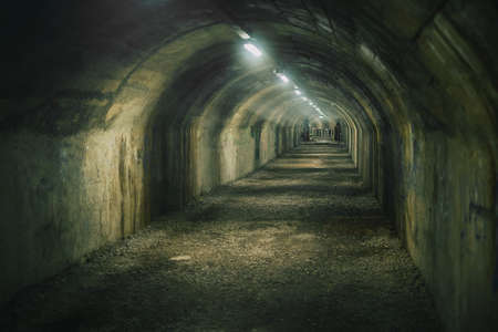 Anti bombing tunnel made in Rijeka made during the war. Hot and humid atmosphere in a man made underground tunnel. Scary underground tunnel.の写真素材