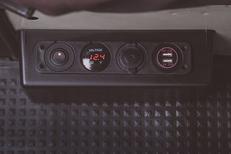 Aftermarket usb and cigarette lighter sockets installed in a vintage van, together with general...
