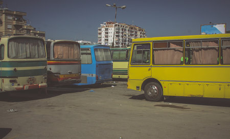 Vintage looking photo of a bus station in durres, Albania. Scene of a 70s or 80s transportation.の写真素材