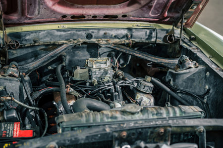 Vintage V8 american muscle car engine bay, worn but still good. Focus on the double barrel...