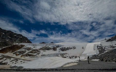 Snowfarming â preserving snow over the summer on the ski region of Solden, storing snow on the mountain for the next ski season. Snow farming or snow harvesting.の写真素材