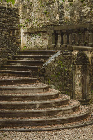 View towards the vintage stairs or staircase made of rock and marble on a terrace in the village of Stanjel, Slovenia on a romantic rainy dayの写真素材