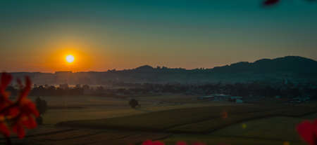 Beautiful colorful morning view of the village of Sankt Georgen im Attergau, idyllical austrian village in early morning, at sunset.の写真素材