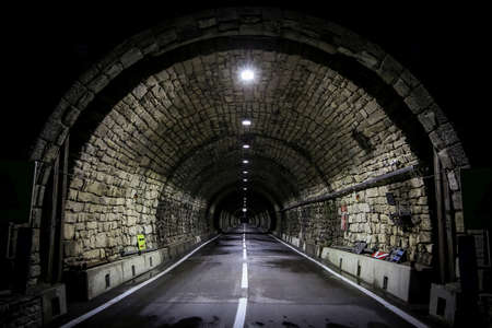 The Grossglockner - Hochalpenstrasse, a famous alpine road in Austria, a picture of Hochtor tunnel at night with lights onの写真素材