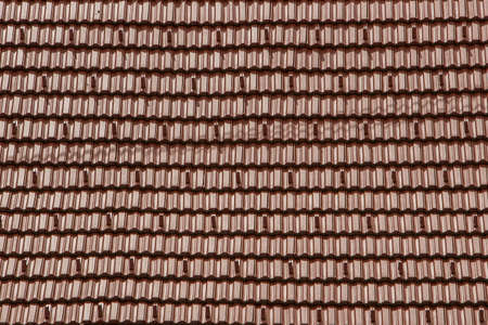 Side view of roof tiles on the top of a hotel. Vintage roof tilesの写真素材