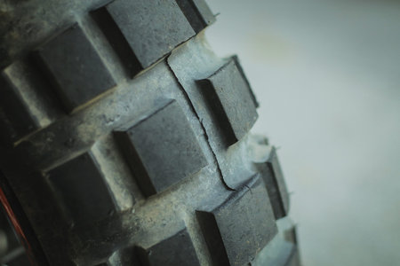 Detail of an offroad off road motorcycle tire mounted on a rear rim.