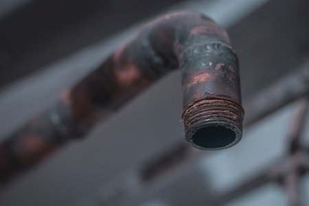 Thread or tread on an old metal pipe used for central heating.の写真素材