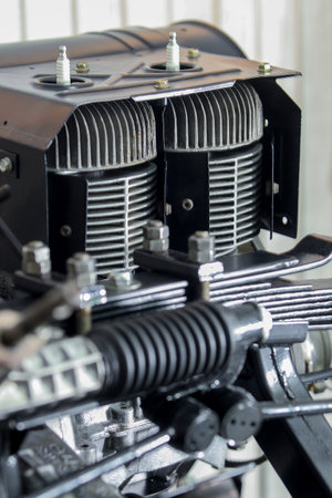 Clean cooling fins and cylinders of an old two stroke car engine with sparkplugs visible.の写真素材