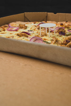 Pizza saver or ottoman, known also as pizza table, used in pizza deliveries to save the pizza being squished in a cardboard box. Tasty delicious pizza being saved by pizza saver.の写真素材