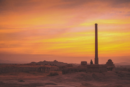 Mistycal and hazy evening view, just minutes after sunset, overlooking the ancient ruins in Hampi, India.の写真素材