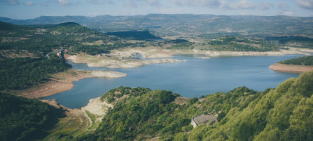 Panorama of Lago del Temo on Sardinia, close to the city of Monteleone Rocca Doria on a cloudy but sunny day.の写真素材
