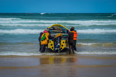 Typical fishing boats in Yoff Dakar, Senegal, called pirogue or piragua or piraga. Colorful boat...