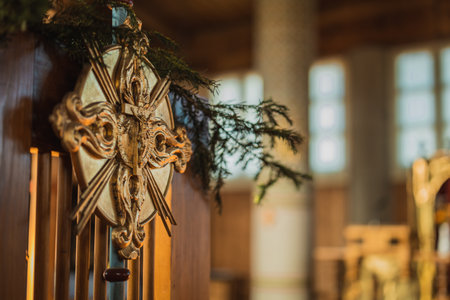 Small metal jesus resting on a cross with ornamentsの写真素材