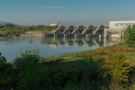 Hydro electric power plant mokrice close to Brezice. View of the hydroelectric barrier on Sava river with lush green surroundings aroundの写真素材