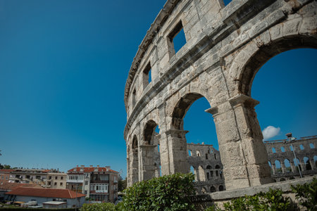 Beautiful colloseum or amphitheatre iin Pula, viewed on a sunny day without clouds. Blue skies above the theatre in pulaの写真素材