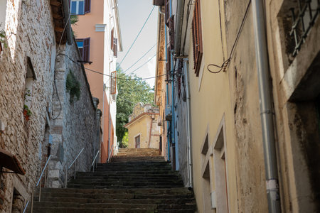 One of many narrow streets in pula, croatia full of high stairs leading to upper city and the fortressの写真素材