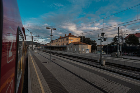 Train station of Divaca viewed from a train standing on a platform. Old but renovated train station on slovenian karst.の写真素材
