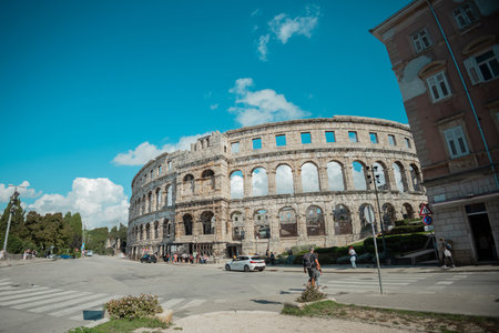Beautiful colloseum or amphitheatre iin Pula, viewed on a sunny day without clouds. Blue skies above the theatre in pulaの写真素材