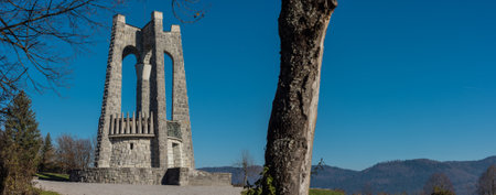 Wide panorama of World war 2 memorial erected by partisans above the village of Stari Trg pri Lozu on Ulaka hill. Visible stone structure on a sunny autumn day..の写真素材