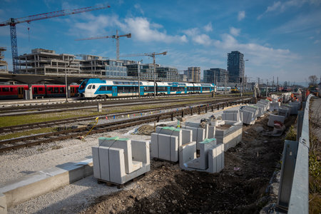 Building new train track on the ljubljana train station as a part of modernisation and renovation in 2024. Visible new blocks for platform and trains..の写真素材