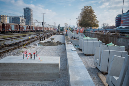 Building new train track on the ljubljana train station as a part of modernisation and renovation in 2024. Visible new blocks for platform and trains..の写真素材