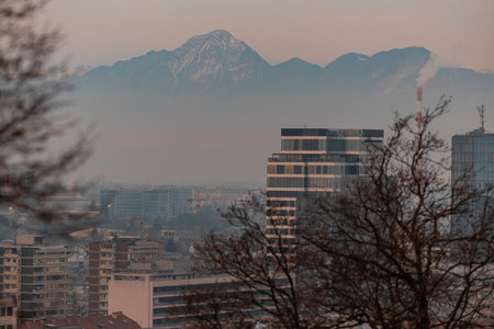 Magnificent winter evening backdrop from ljubljana castle. Visible beautiful kamnik mountains with hotels and skyscrapers in the foreground...の写真素材
