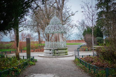 Metal gazebo in the gardens on the hill above the city of graz. Autumn settings, bare trees and beautiful historical gazeboの写真素材
