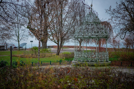 Metal gazebo in the gardens on the hill above the city of graz. Autumn settings, bare trees and beautiful historical gazeboの写真素材