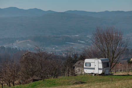Old vintage caravan trailer used as an alternative for a cottage or holiday home. Early winter setting, great view from the place where caravan is..の写真素材