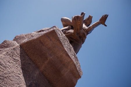 The statue of african renaissance or "monument de la renaissance africaine" on a sunny february day in Dakar, Senegal. View from the bottom of the stairs leading up.の写真素材
