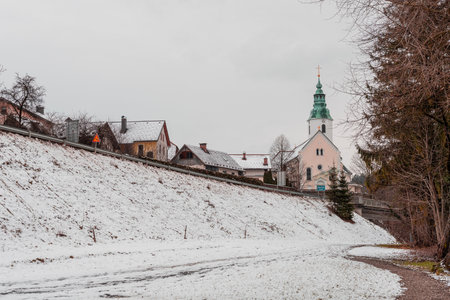 Day view of church, night setting in Ljubno ob Savinji city in Slovenia. Cloudy foggy day.の写真素材