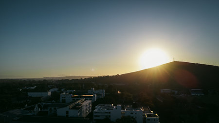 Evening aerial drone panorama above Stellenbosch, south Africa with a view towards the Simonsberg and hottentots mountain. Beautiful evening viewの写真素材