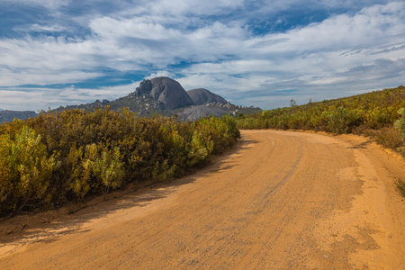 panorama of Paarl mountain nature reserve above the city of Paarl in South Africa. Cloudy day with visible lake and fynbos vegetation dominated by massive rounded granite rock formationsの写真素材