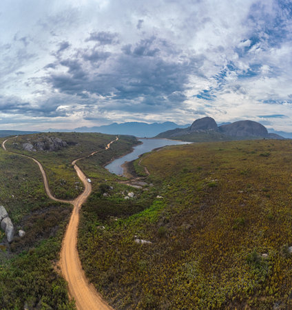 Aerial drone panorama of Paarl mountain nature reserve above the city of Paarl in South Africa. Cloudy day with visible lake and fynbos vegetation dominated by massive rounded granite formationsの写真素材