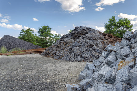 Scrapheap with metal waste piles ready to be recycled.