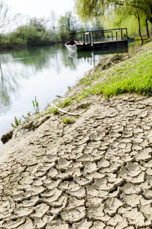 Dried and cracked soil at river band の写真素材