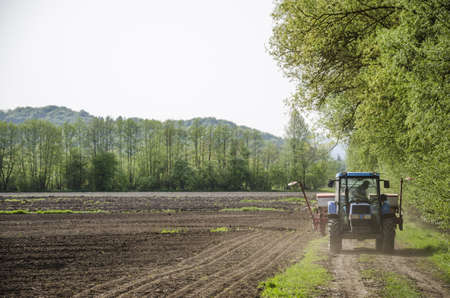 Farmer checking mechanization before planting corn seeds の写真素材