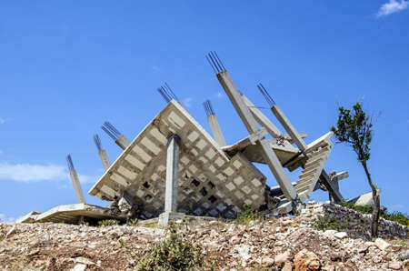 Collapsed construction because of bad construction planning with insufficient reinforcements, Ksamil, Albania の写真素材