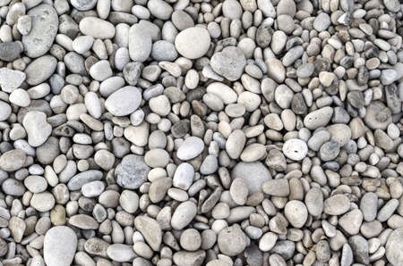 Texture of pebbles from a beach shore.の写真素材