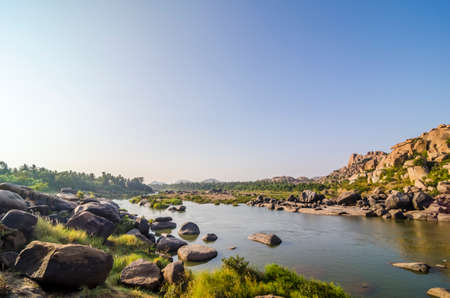Tungabhadra river near ancient Hampi ruins, Hampi, India.の写真素材