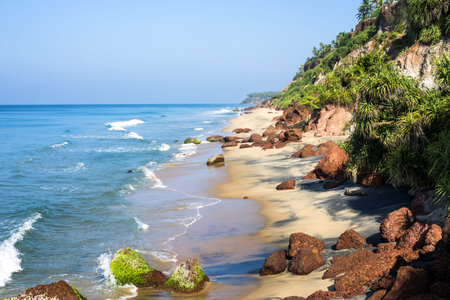 Peacefull tropical beach with cliffs in Varkala, Kerala, India.の写真素材