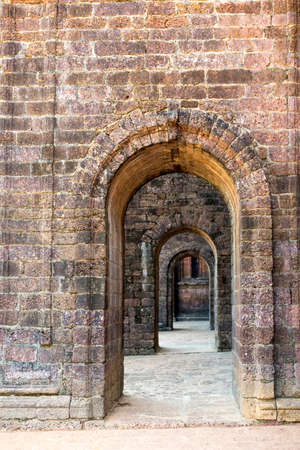 Stone arched passages of a historical church.の写真素材