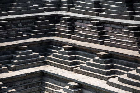 Close up stepped water tank near the Underground Temple in Pushkarani, Hampi, India.の写真素材